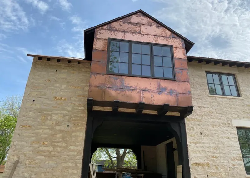 Copper metal panel facade on a stone building for Skylight Installation in Campton Hills