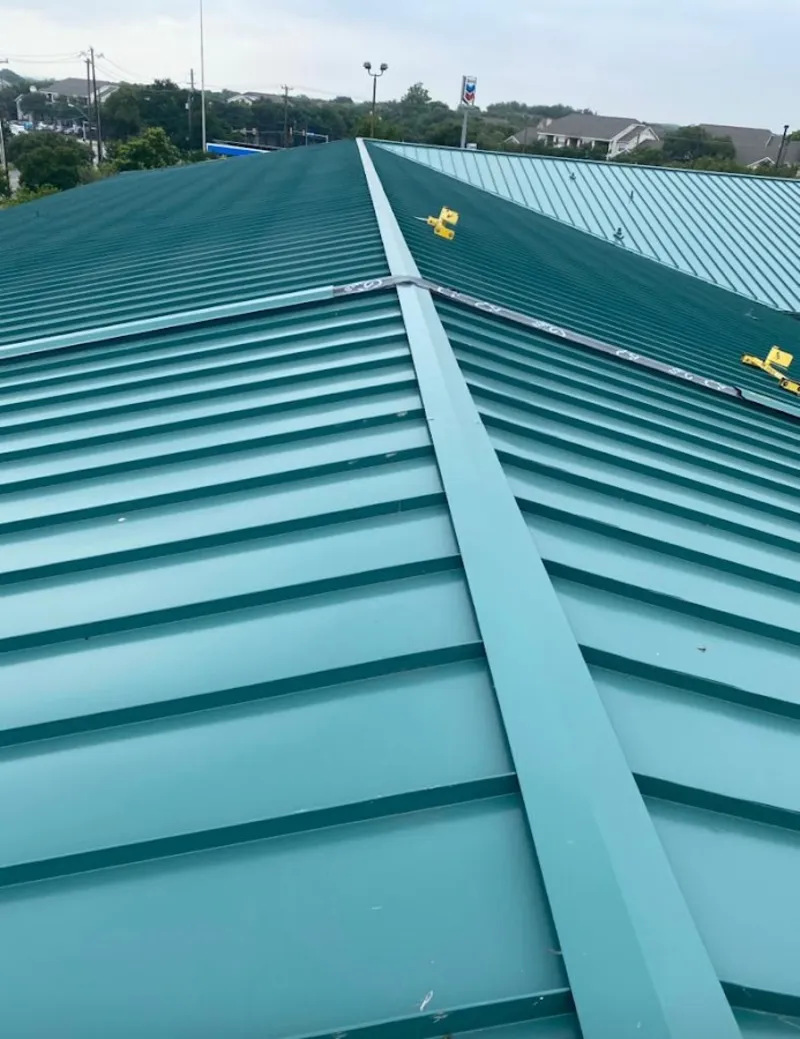 Green commercial metal roof ridge and valley for Metal Roof Repair in Campton Hills